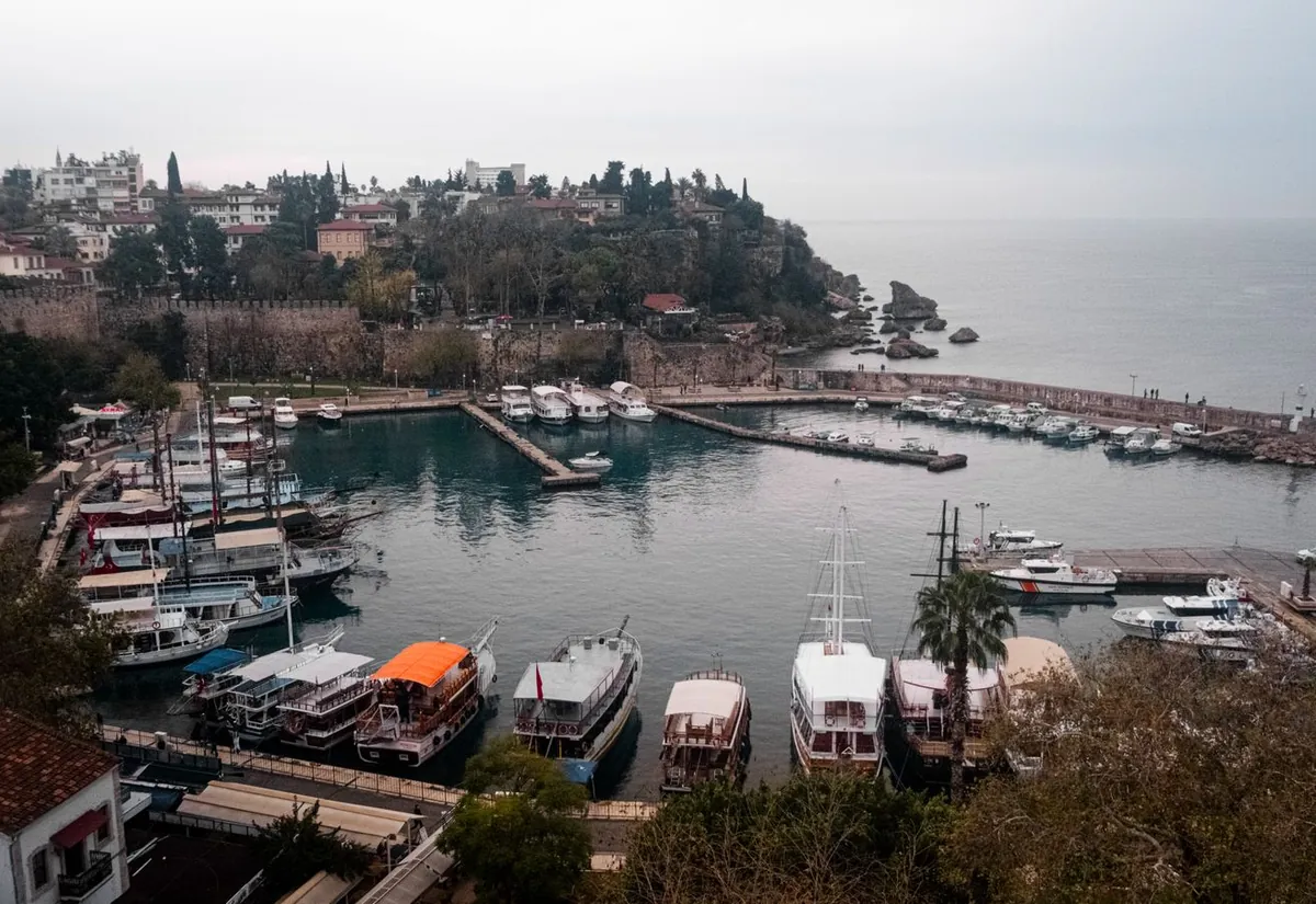 Aerial view of a Mediterranean fishing harbour and coastline